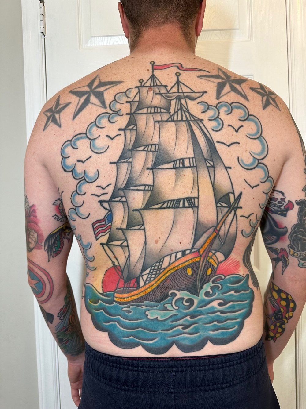 Full-back sailing ship — tattoo by Scott Denhalter